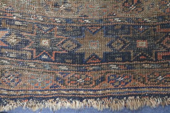 A Shiraz rug, a Bokhara saddlecloth and another rug (wear)